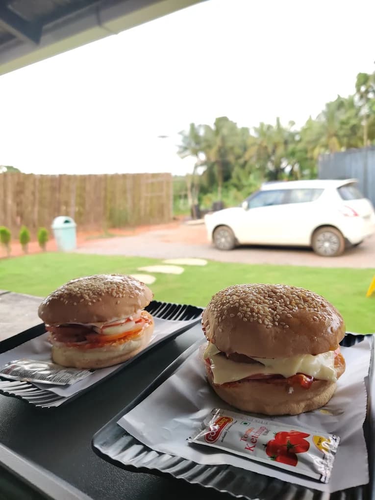 Double cheese veg burger combo deals at River Queen, the best cafe in Puttur