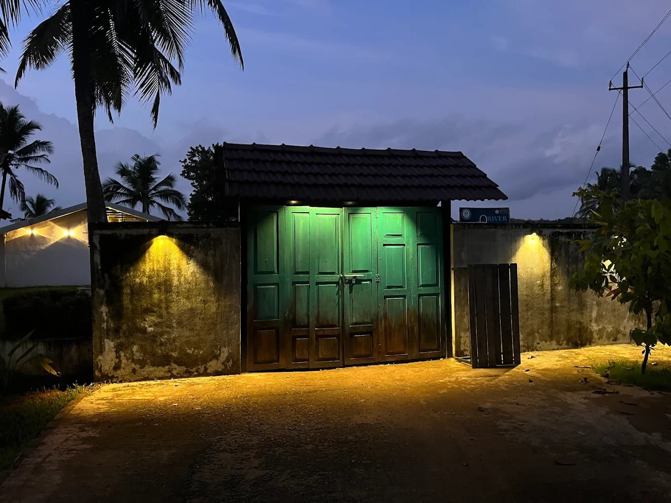 Stunning entrance lighting and evening ambiance at River Queen cafe Shantimogaru