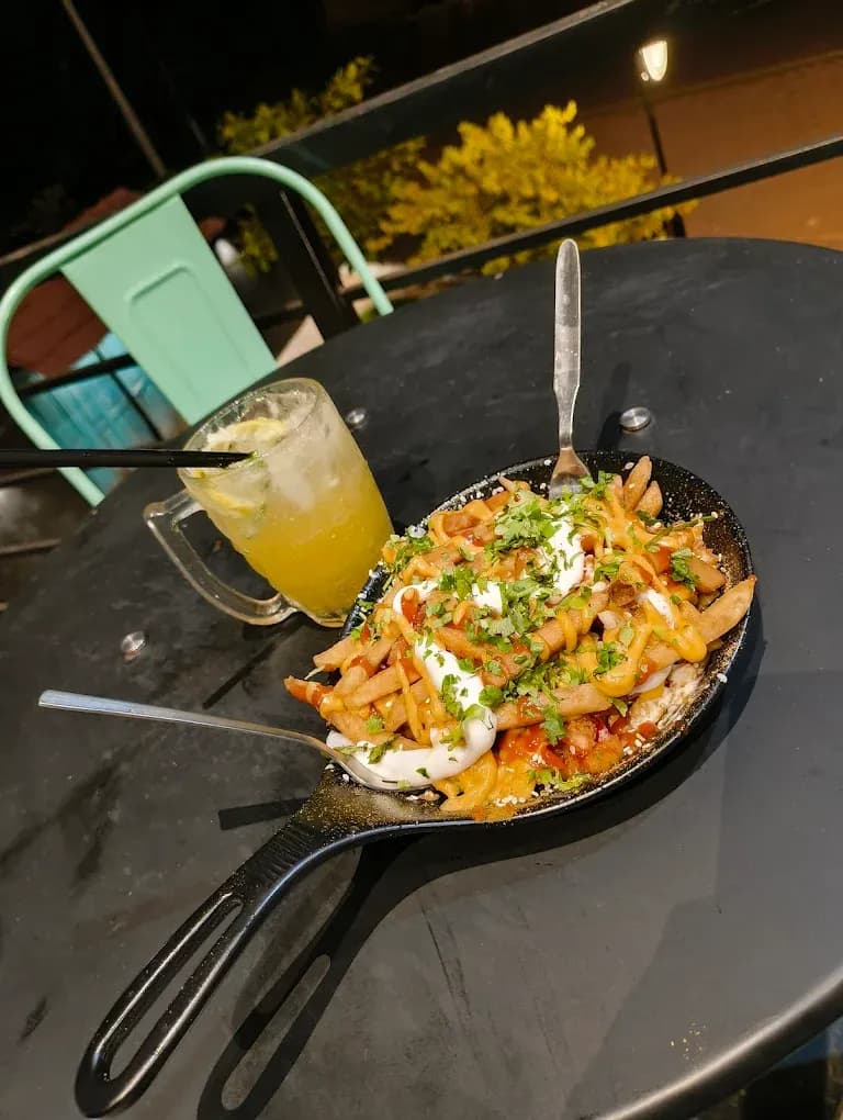 Spicy Schezwan noodles and pan-fry pasta at River Queen, best cafe in Puttur