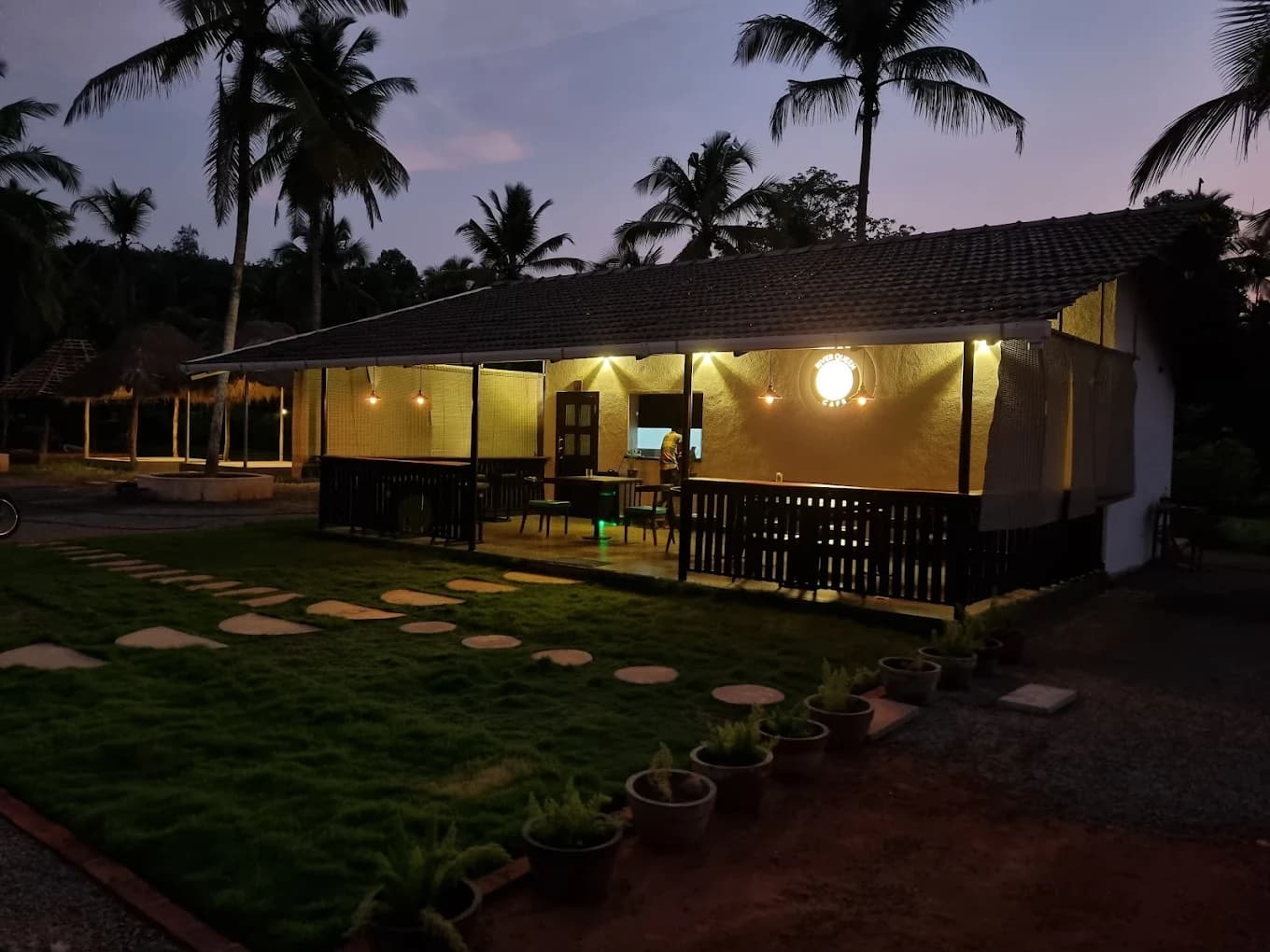Evening ambience at River Queen, the best cafe in Puttur with outdoor garden seating