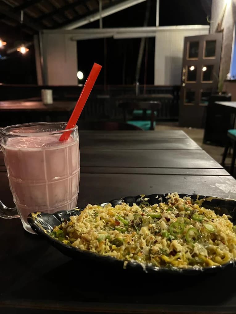 Popular cheesy peri peri french fries at River Queen Lakeside Cafe Shantimogaru