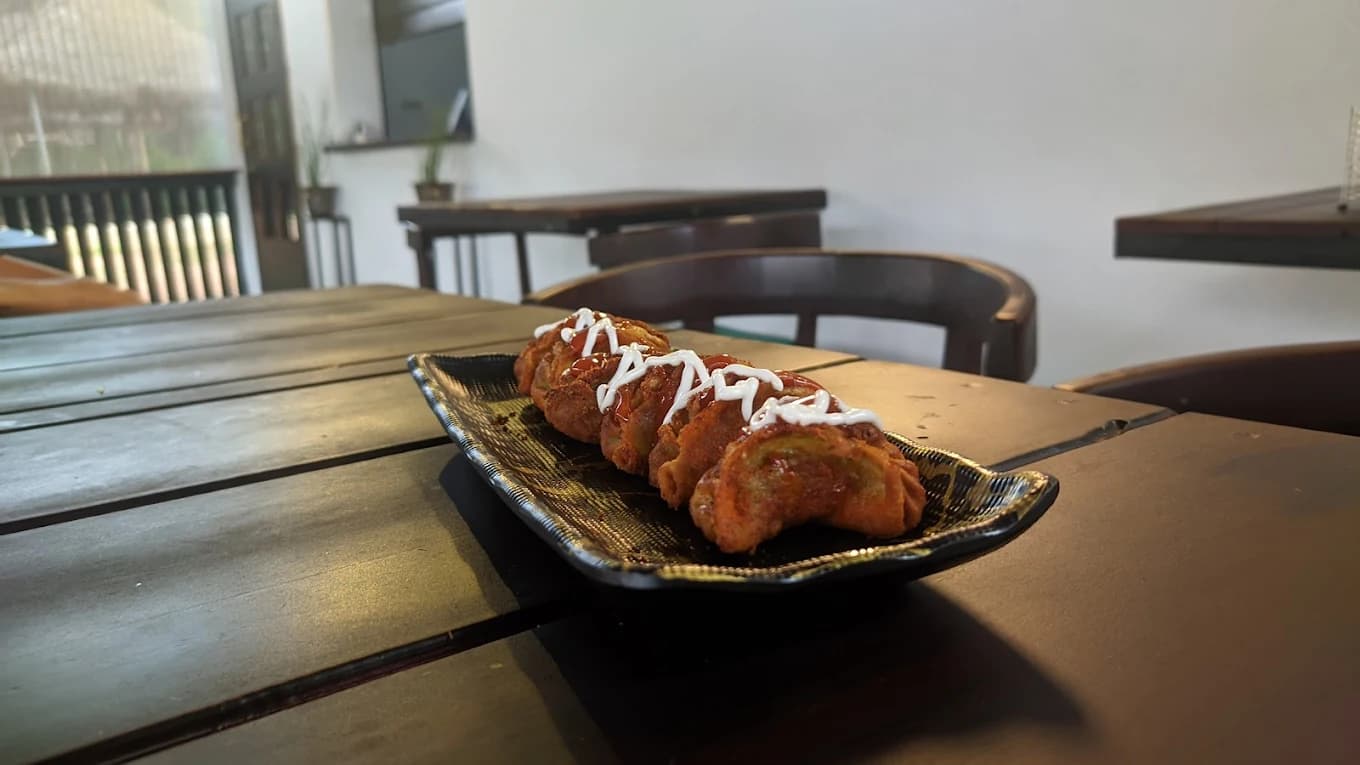 Crispy fried chicken momos at River Queen, a top-rated cafe in Shantimogaru, Puttur