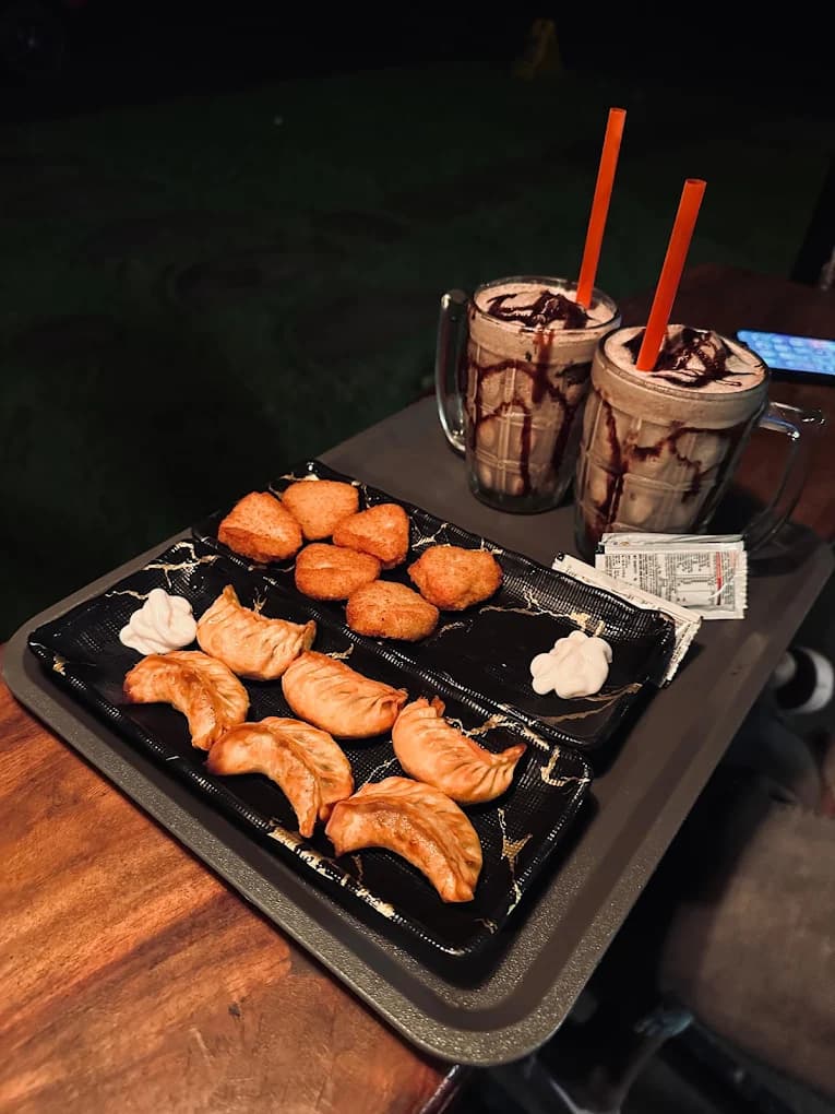 Snacks and cold coffee served at River Queen cafe in Shantimogar Puttur, a popular spot among the best cafes in Puttur