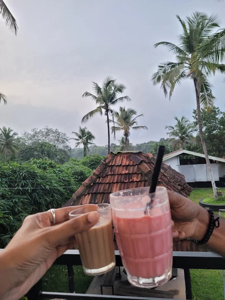 Strawberry smoothie and masala chai combo at River Queen cafe Shantimogaru